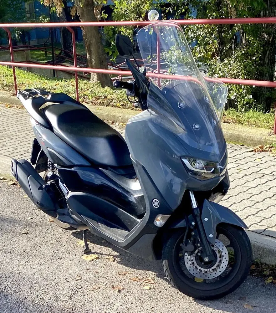 Front of a grey scooter, photographed at check-in