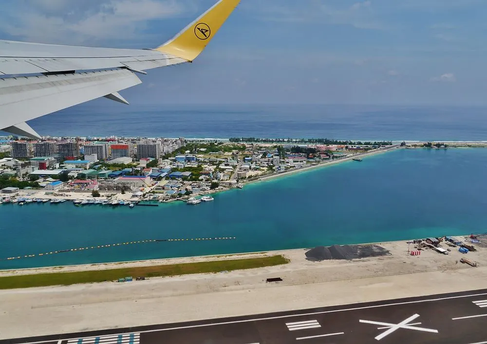 Hulhumalé seen from a plane over the airport runway, with its harbour and apartment blocks